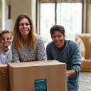 Happy family unpacking boxes in their new Atlanta home